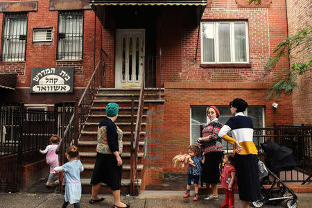 People from the Satmar Hasidic Jewish community are seen in the Brooklyn borough of New York City, U.S., August 15, 2017. REUTERS/Stephanie Keith/Files