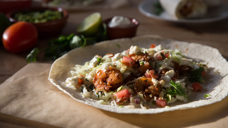 blackened shrimp burrito on table