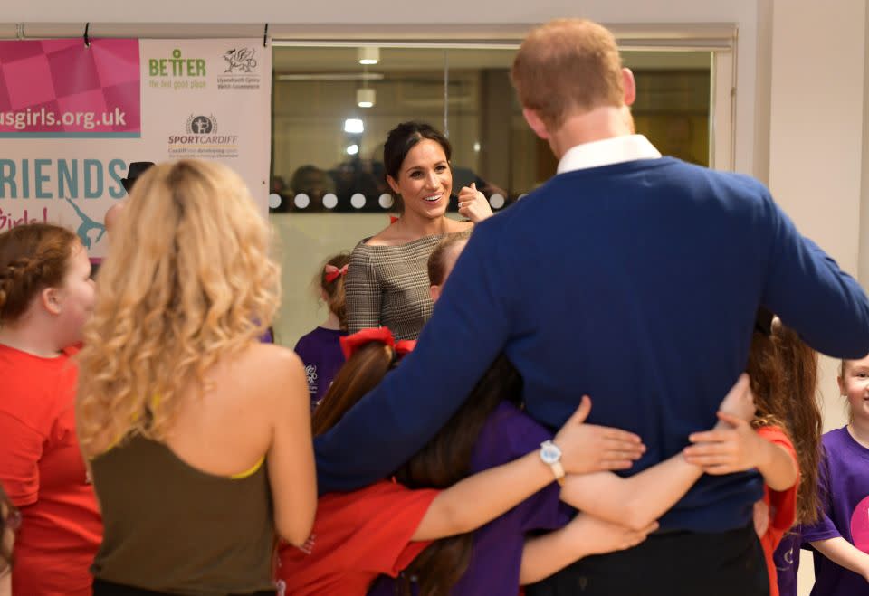 The couple were completely hands-on and relaxed when faced with their young fans. Photo: Getty