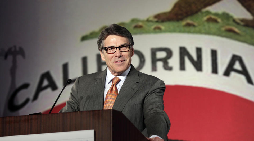 FILE - In this Oct. 5, 2013 file photo Texas Gov. Rick Perry gives the keynote speech at the California Republican Party convention in Anaheim, Calif. California Gov. Jerry Brown said Friday, May 2, 2014, it appears there was little California could have done to keep Toyota from moving its U.S. headquarters and about 3,000 jobs to Texas, saying "change is inevitable." Perry said his state offered Toyota $40 million in incentives. (AP Photo/Reed Saxon, File)