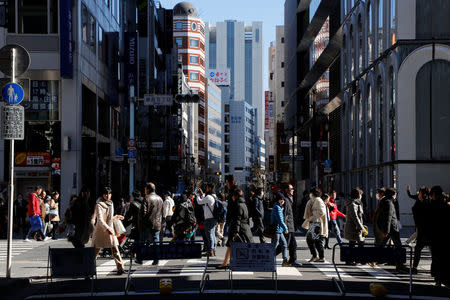 People walk on a street at Tokyo's Ginza shopping district, Japan, February 12, 2017. REUTERS/Toru Hanai