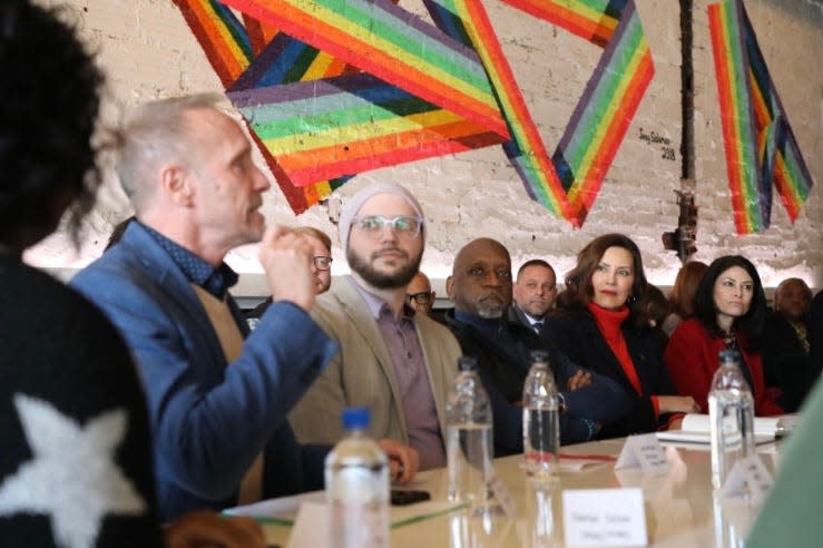 Gov. Gretchen Whitmer and Attorney General Dana Nessel listen during a roundtable of members of the LGBTQ community at Bobcat Bonnie's in Ferndale on Feb. 24, 2023, in support of a bill to amend a state civil rights act to include LGBGQ protections.