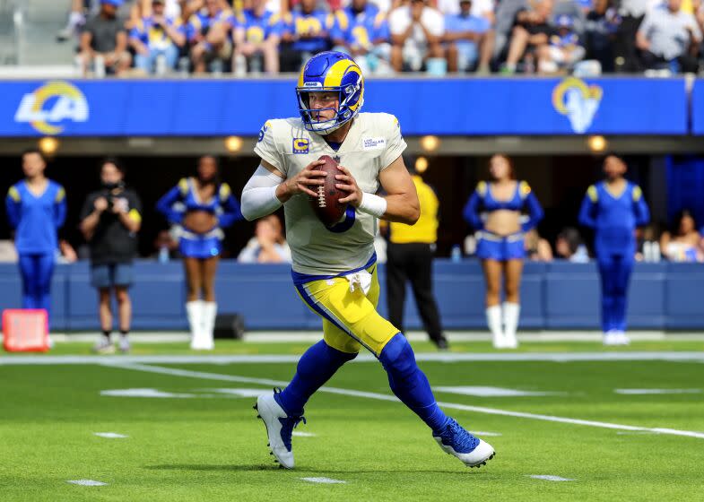 Los Angeles, CA - September 18: Rams quarterback Matthew Stafford rolls out for a pass.