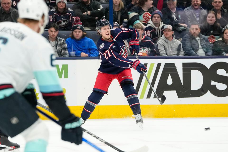 Jan 13, 2024; Columbus, Ohio, USA; Columbus Blue Jackets defenseman Adam Boqvist (27) makes a pass during the third period of the NHL hockey game against the Seattle Kraken at Nationwide Arena. The Blue Jackets lost 7-4.