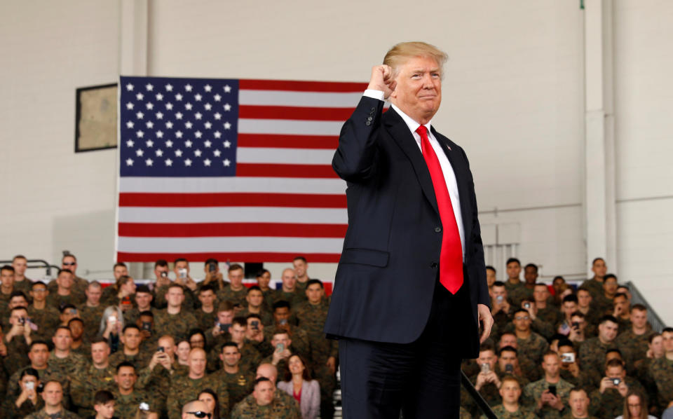 U.S. President Donald Trump pumps his fist after speaking at Marine Corps Air Station Miramar in San Diego, California, U.S. March 13, 2018. REUTERS/Kevin Lamarque     TPX IMAGES OF THE DAY