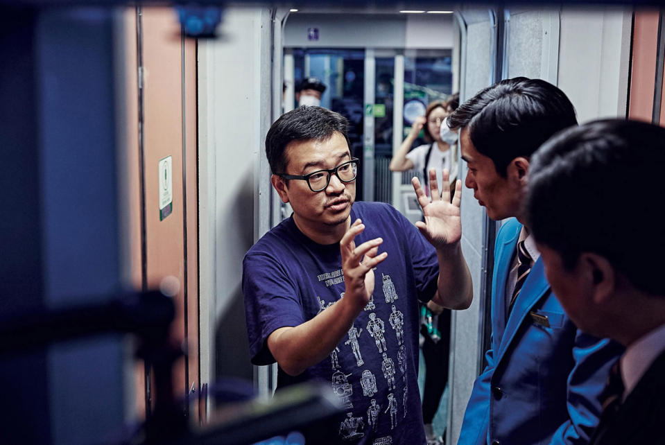 Yeon Sang-ho planning a shot on the set of "Train to Busan"