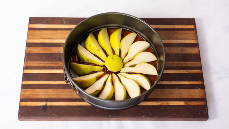 pear slices in cake pan 