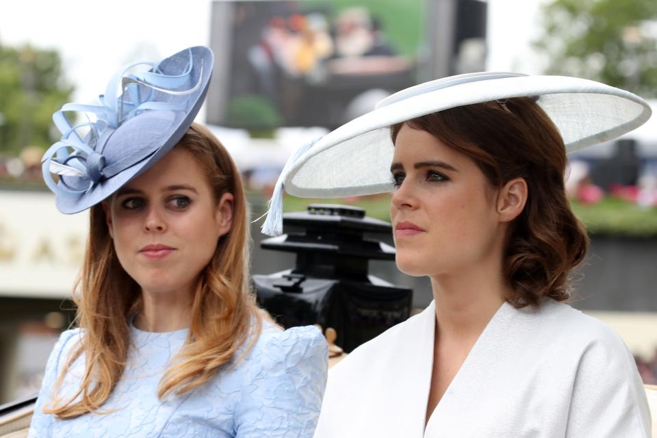 Princess Beatrice of York (L) wearing Juliette Botterill and Princess Eugenie of York wearing Emily London
