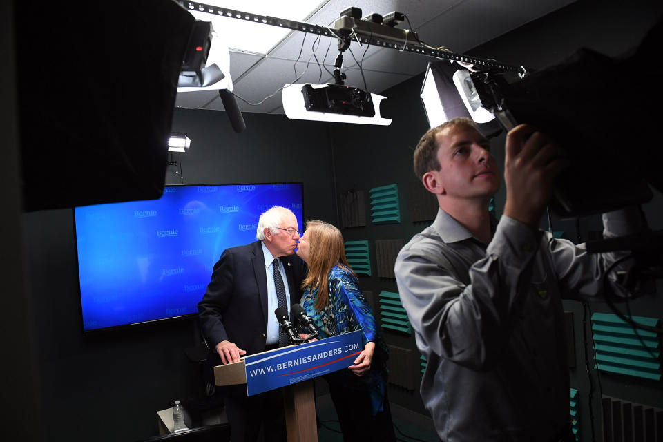 Bernie Sanders kisses his wife, Jane, as he prepares to speak for a video to supporters. (Photo: Matt McClain/Pool/The Washington Post via AP)