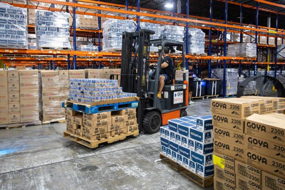 A volunteer at Global Empowerment Management HQ drives a forklift with a crate of canned food that would be packed and sent to areas in the Caribbean affected by Hurricane Beryl at 1850 NW and 84th Ave. on Tuesday, July 2, 2024 in Doral, Fla.