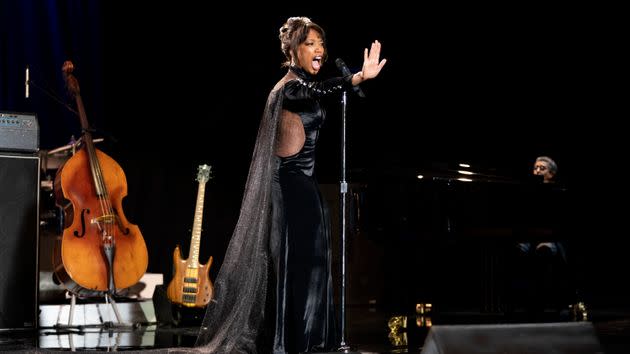 Naomi recreating Whitney's iconic performance at the American Music Awards in 1994