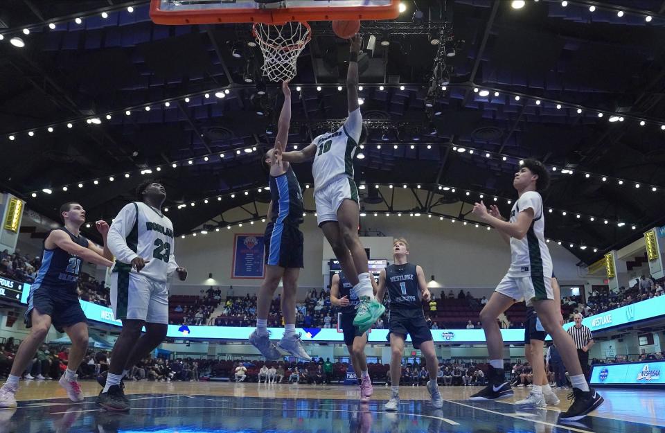 Woodlands' Eric Woodberry (10) drives to the basket in the boys basketball Class B semifinal game against Westlake at Westchester County Center in White Plains on Saturday, Feb. 24, 2024.