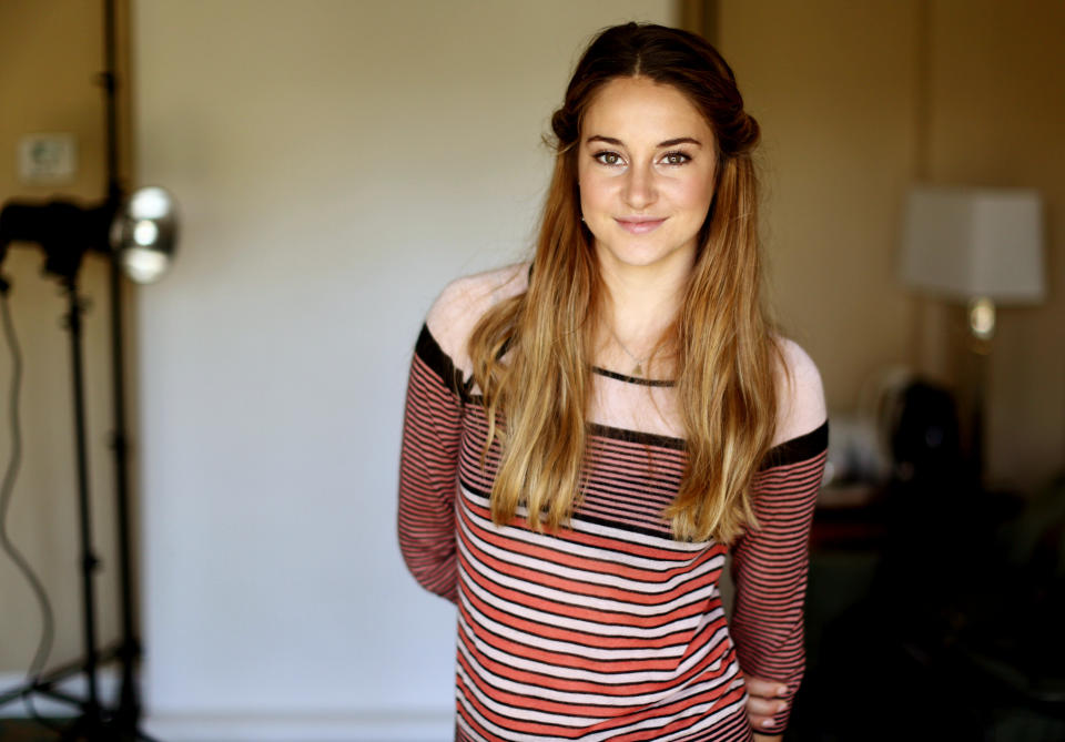 In this Monday, July 29, 2013 photo, actress Shailene Woodley poses for a portrait while promoting her new film "The Spectacular Now" at the Four Seasons Hotel in Los Angeles. An actress since age 5, Woodley earned notice, and an Independent Spirit Award, for playing the angst-ridden teen daughter of George Clooney’s character in 2011’s “The Descendants.” “The Spectacular Now” releases Friday, Aug. 2, 2013. (Photo by Matt Sayles/Invision/AP)