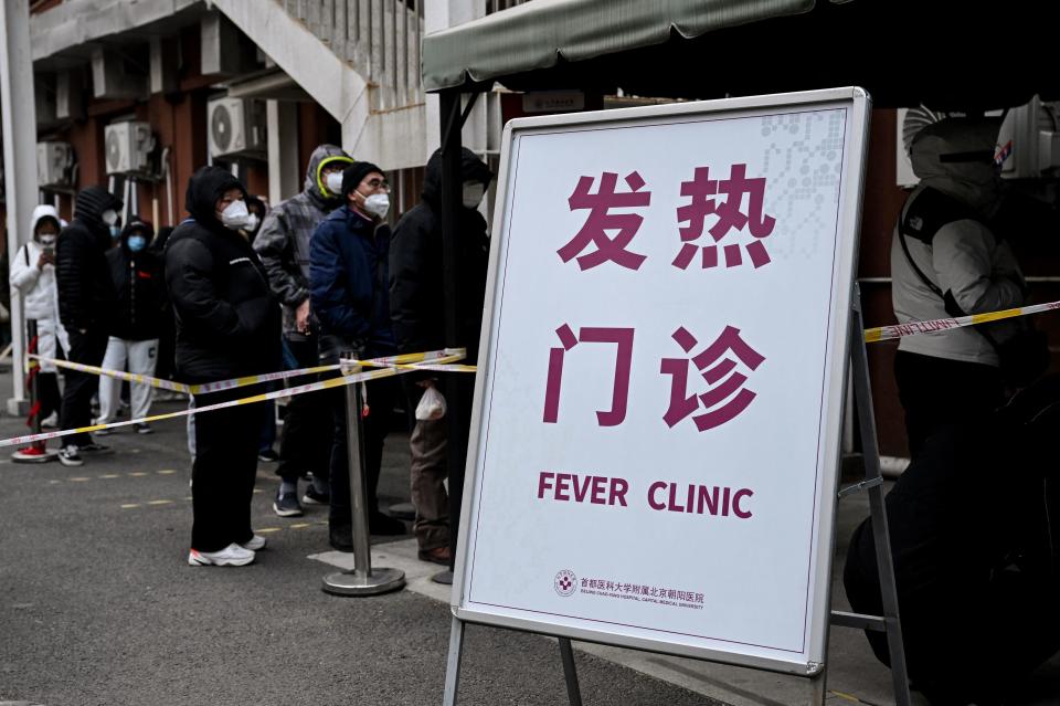 People queue at a fever clinic to be tested for the Covid-19 in Beijing on December 9, 2022. (Photo by Noel CELIS / AFP) (Photo by NOEL CELIS/AFP via Getty Images)