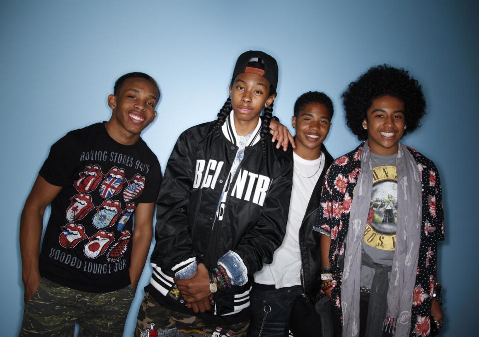 CAPTION CORRECTION OF NAME: In this Tuesday, April 9, 2013 photo, members of teen R&B boy band, Mindless Behavior, Princeton, from right, Roc Royal, Ray Ray, and Prodigy pose for photos in Los Angeles. The group kicks off their “All Around the World” tour July 3, 2013, in Stockton, Calif. (AP Photo/Jae C. Hong)