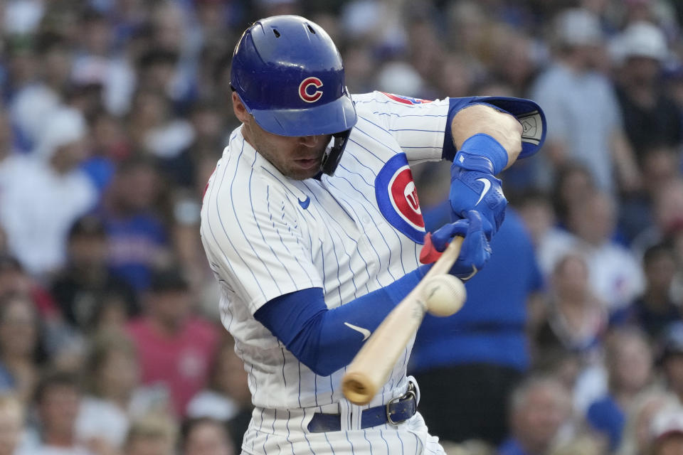 Chicago Cubs' Nico Hoerner hits a double against the Cincinnati Reds during the first inning of a baseball game in Chicago, Thursday, Aug. 3, 2023. (AP Photo/Nam Y. Huh)