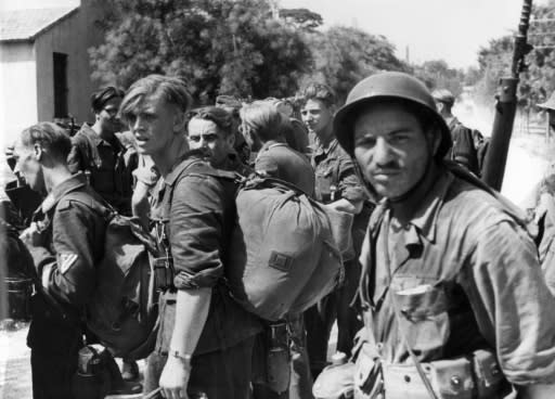 Algerian riflemen guarding German prisoners in Marseille, southern France, in August 1944