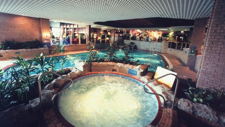 Indoor Jacuzzi (fore.) & swimming pool where England's Princess Diana & Fergie, Duchess of York, once swam & relaxed, at modern Craigendarroch Hotel nr. Balmoral estate. 