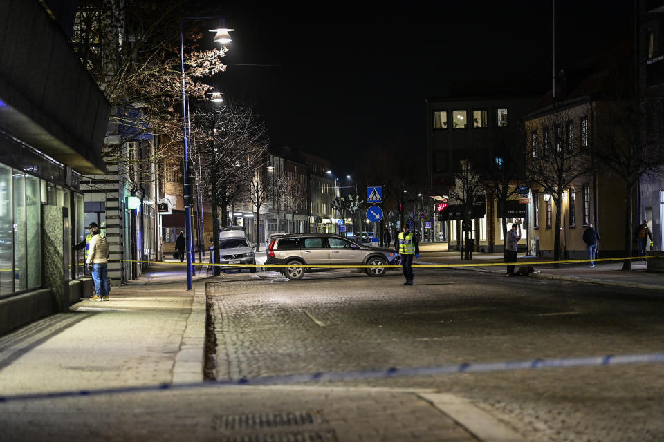 Police are seen in the area after several people were attacked in Vetlanda, Sweden, Wednesday, March 3, 2021. Swedish police say a man has assaulted at least eight people in a southern Sweden town, and that the case was being investigated as ”a suspected terrorist crime.” Police said a man in his 20s attacked people in the small town of Vetlanda, about 190 kilometers (118 miles) southeast of Goteborg, Sweden’s second largest city. (Mikael Fritzon/TT News Agency via AP)