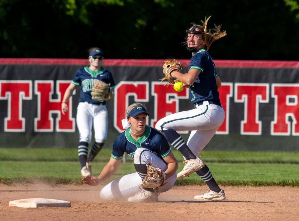 Indianapolis Cathedral High School sophomore Anna Moore (5) turns to make a throw to first base during a IHSAA Class 4A Softball Sectional Championship game against Lawrence North High School, Friday, May 26, 2023, at North Central High School.