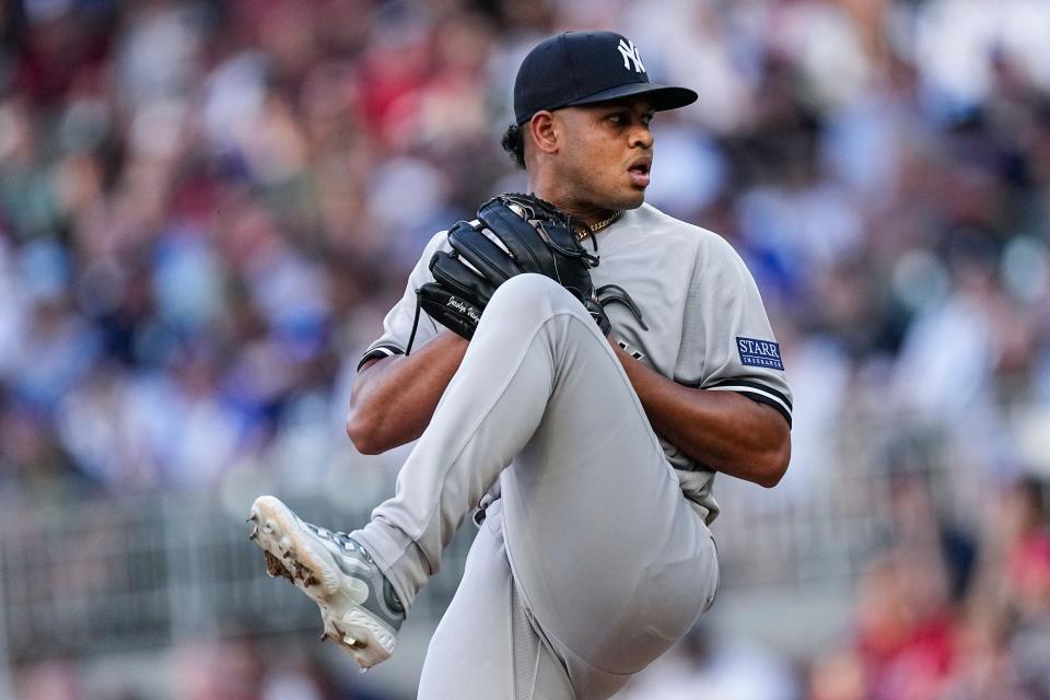 New York Yankees starting pitcher Randy Vasquez works against the Atlanta Braves during the first inning of a baseball game Wednesday, Aug. 16, 2023, in Atlanta. (AP Photo/John Bazemore)