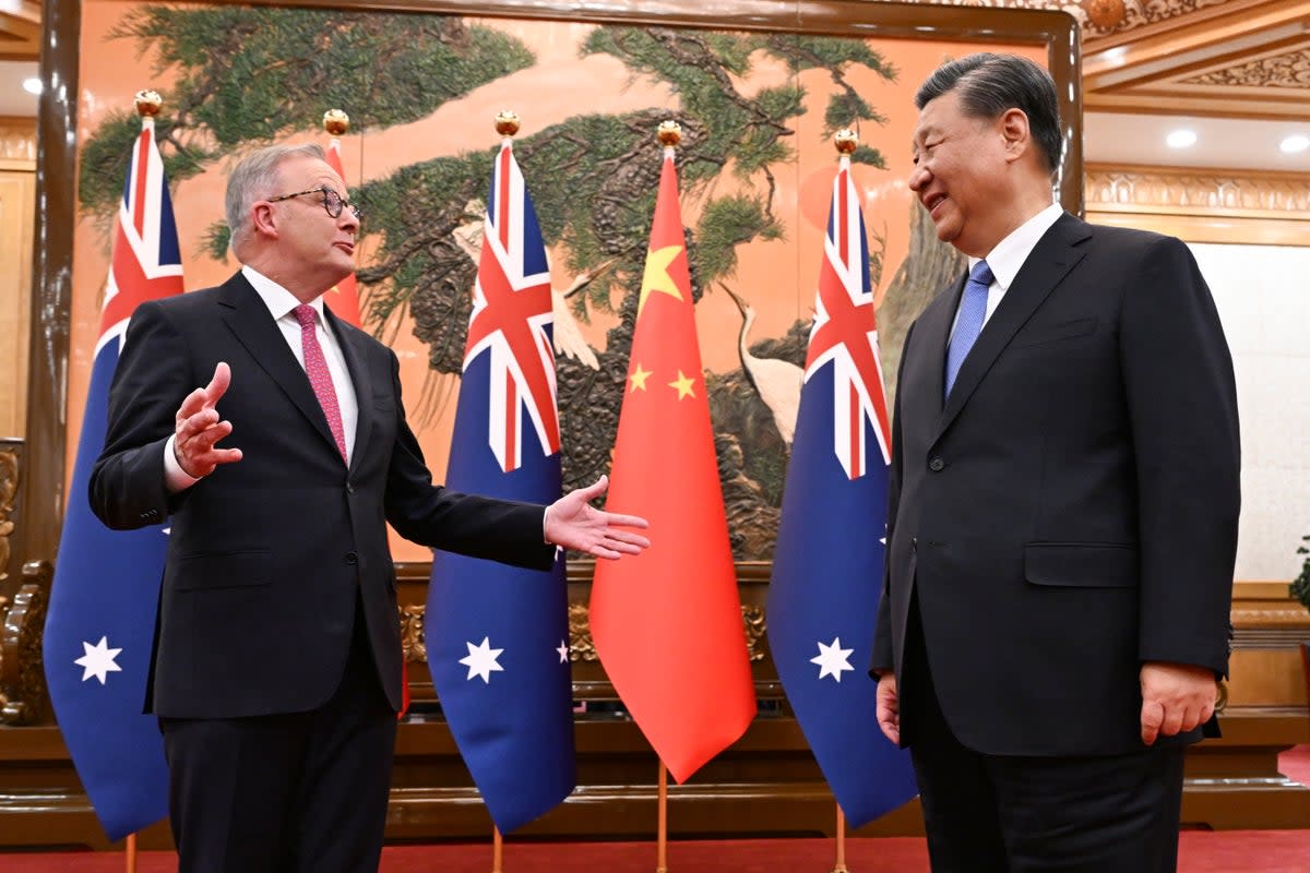 Australia's Prime Minister Anthony Albanese, left, gestures as he meets with China's President Xi Jinping at the Great Hall of the People in Beijing (AP)