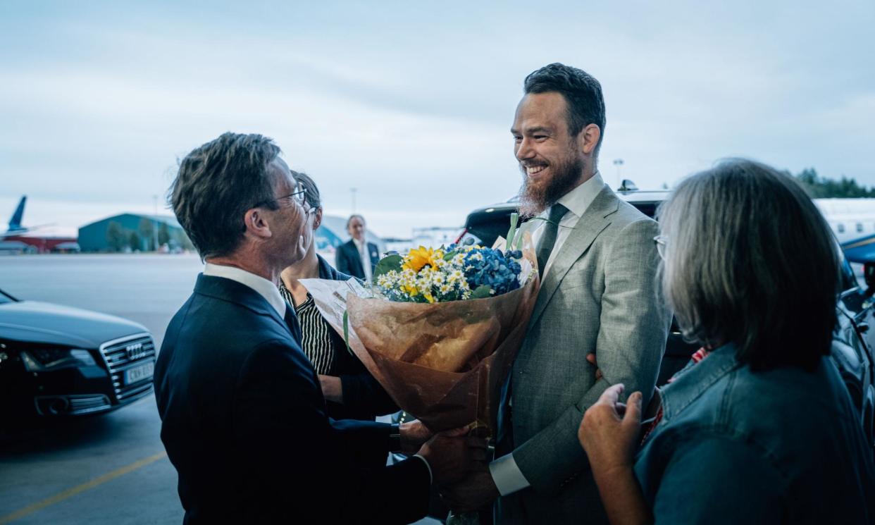 <span>Johan Floderus returns home after being imprisoned in Iran and is greeted by Swedish prime minister, Ulf Kristersson.</span><span>Photograph: Tom Samuelsson/Regeringskansliet/REX/Shutterstock</span>