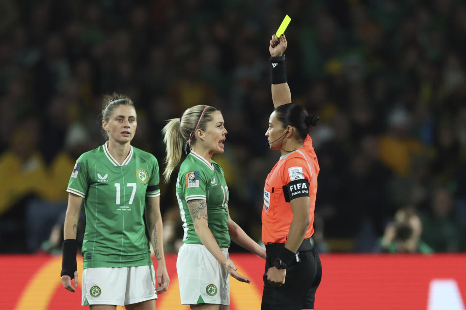 FILE - Referee Edina Alves Batista shows a yellow card to Ireland's Denise O'Sullivan during a Women's World Cup soccer match in Sydney, Australia, July 20, 2023. Women match officials were appointed to work the Copa America for the first time on Friday, May 24, 2024. (AP Photo/Jessica Gratigny)