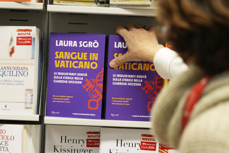 Copies of the book Sangue in Vaticano (Blood in The Vatican) by lawyer Laura Sgro', are displayed in a bookshop during its launch in Rome, Tuesday, Nov. 29, 2022. The book is about the case of Swiss Guard Corporal Cedric Tornay who allegedly committed suicide in the Vatican after killing guards' commander Alois Estermann and his Venezuelan wife Gladys Meza Romero in 1998. (AP Photo/Andrew Medichini)