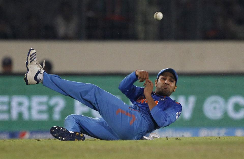 India's Yuvraj Singh throws the ball as he fields during their ICC Twenty20 Cricket World Cup semifinal match against South Africa in Dhaka, Bangladesh, Friday, April 4, 2014. (AP Photo/A.M. Ahad)