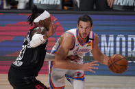 Houston Rockets' Robert Covington (33) defends as Oklahoma City Thunder's Danilo Gallinari (8) handles the ball during the second half of an NBA first-round playoff basketball game in Lake Buena Vista, Fla., Wednesday, Sept. 2, 2020. (AP Photo/Mark J. Terrill)