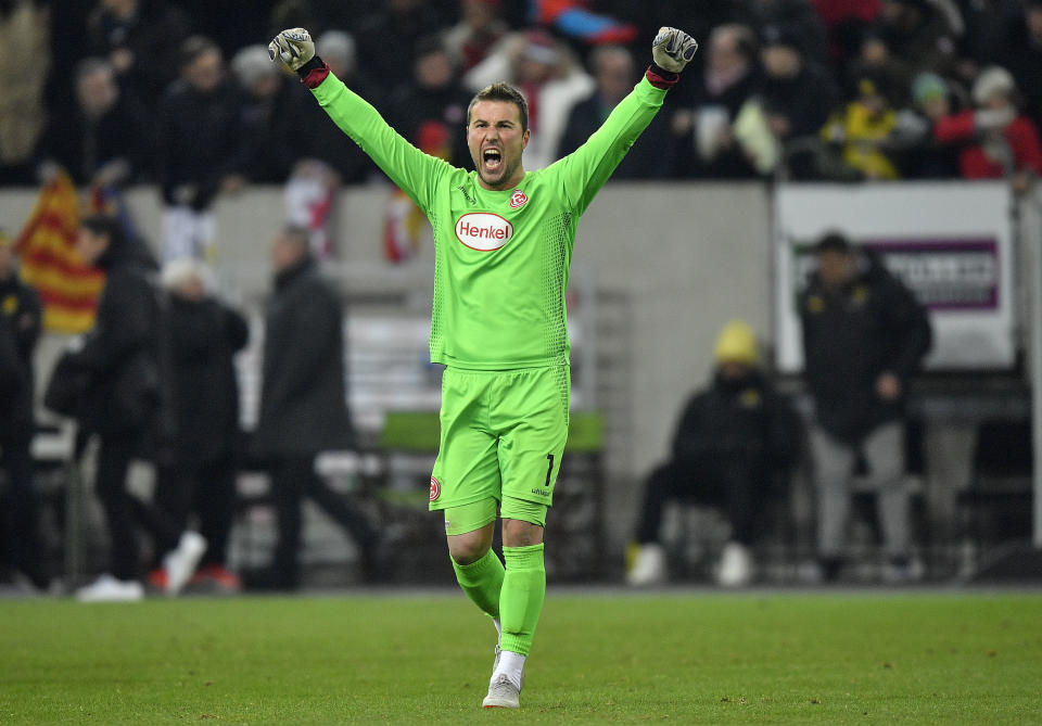 Duesseldorf goalkeeper Michael Rensing celebrates after the German Bundesliga soccer match between Fortuna Duesseldorf and Borussia Dortmund in Duesseldorf, Germany, Tuesday, Dec. 18, 2018. Fortuna defeated Dortmund with 2-1. (AP Photo/Martin Meissner)