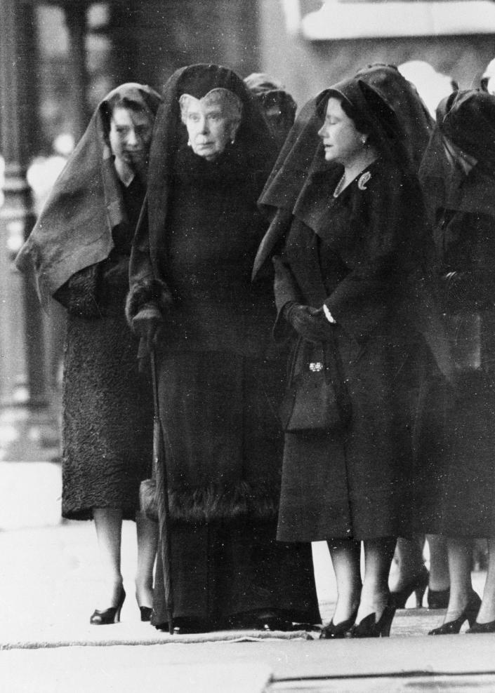 Queen Elizabeth, Elizabeth the Queen Mother and Queen Mary wearing traditional mourning wear as they greeted the coffin of King George VI from Sandringham. (Getty Images)