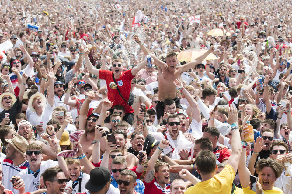 Football fever: England fans celebrate at the Isle of Wight festival during the World Cup. (PA)