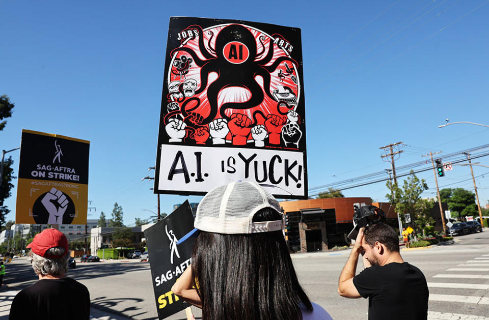 A sign refers to A.I. as striking SAG-AFTRA members and supporters picket outside Disney Studios on day 95 of their strike against the Hollywood studios on October 16, 2023 in Burbank, California.