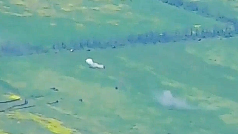 This photo taken from video released by Russian Defense Ministry Press Service on Monday, June 5, 2023, show a Ukrainian military vehicle being hit during a combat in Ukraine. The Russian Defense Ministry said the Russian military fended off an attempt by Ukraine to launch an attack in the southern part of the Donetsk region on Sunday. (Russian Defense Ministry Press Service via AP)
