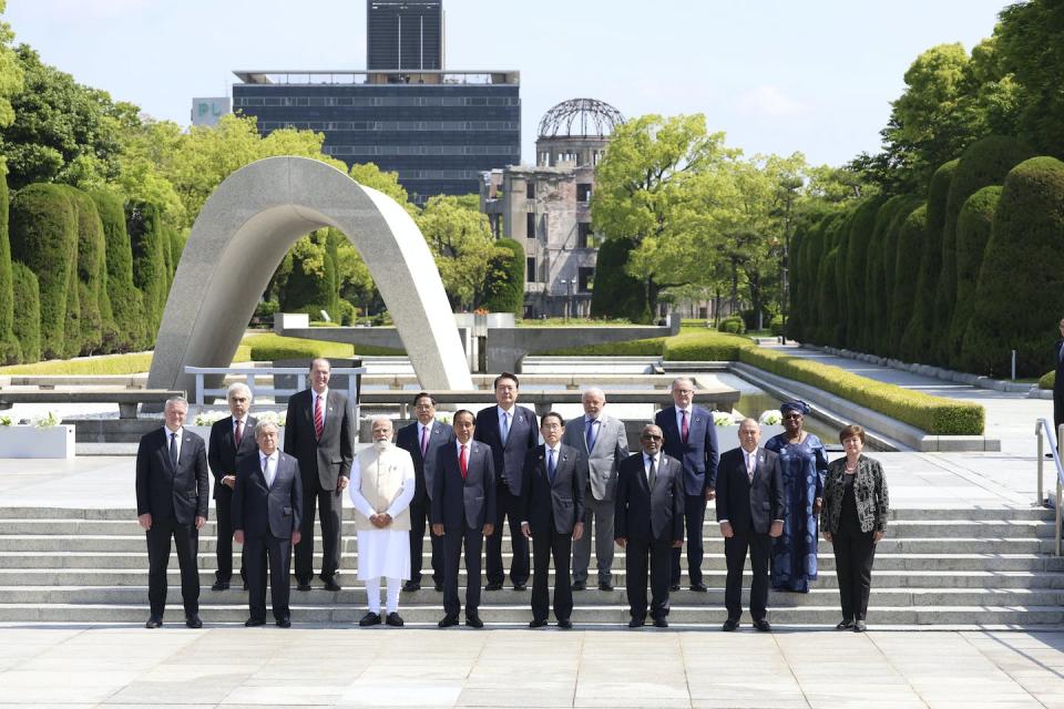 Global leaders pose for a photo after laying flowers at the Cenotaph for the Victims of the Atomic Bomb (back left) at the Hiroshima Peace Memorial Park. Japan pool/AP