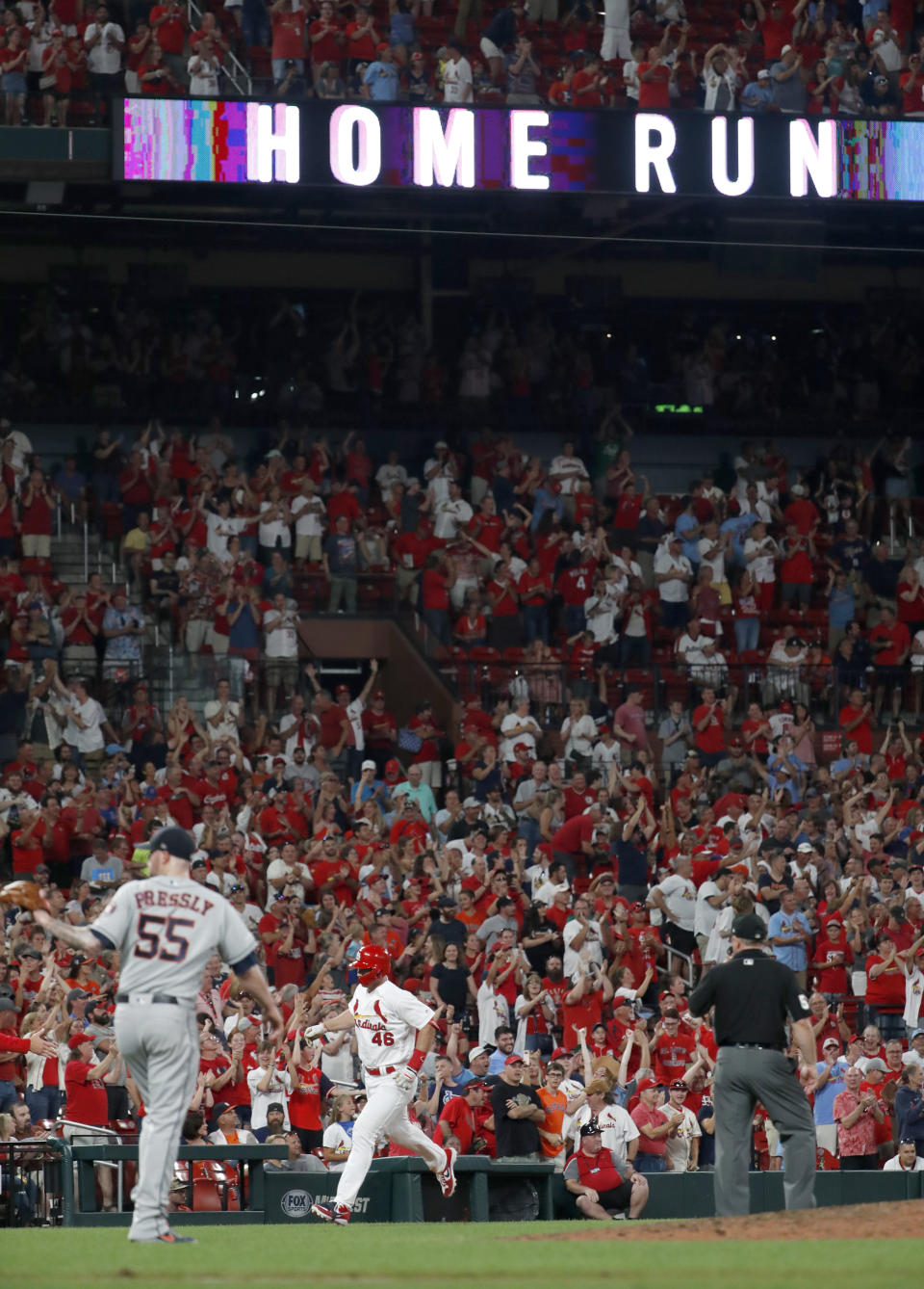St. Louis Cardinals' Paul Goldschmidt (46) rounds the bases after hitting a three-run home run off Houston Astros relief pitcher Ryan Pressly (55) during the eighth inning of a baseball game Friday, July 26, 2019, in St. Louis. (AP Photo/Jeff Roberson)