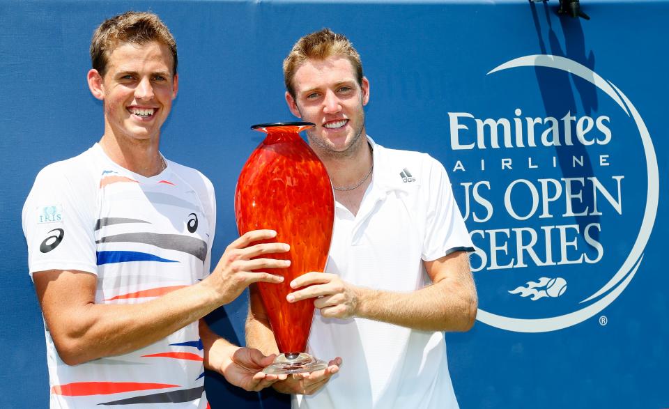 Vasek Pospisil of Canada and Jack Sock pose with their trophy after defeating Steve Johnson and Sam Querrey during the finals of the BB&T Atlanta Open at Atlantic Station on July 27, 2014. (Photo by Kevin C. Cox/Getty Images)