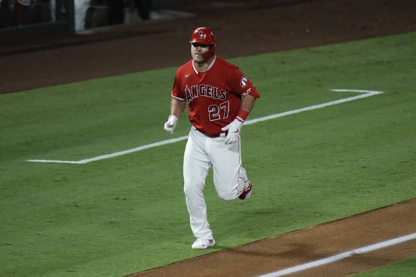 Los Angeles Angels' Mike Trout rounds the bases after hitting a two-run home run.