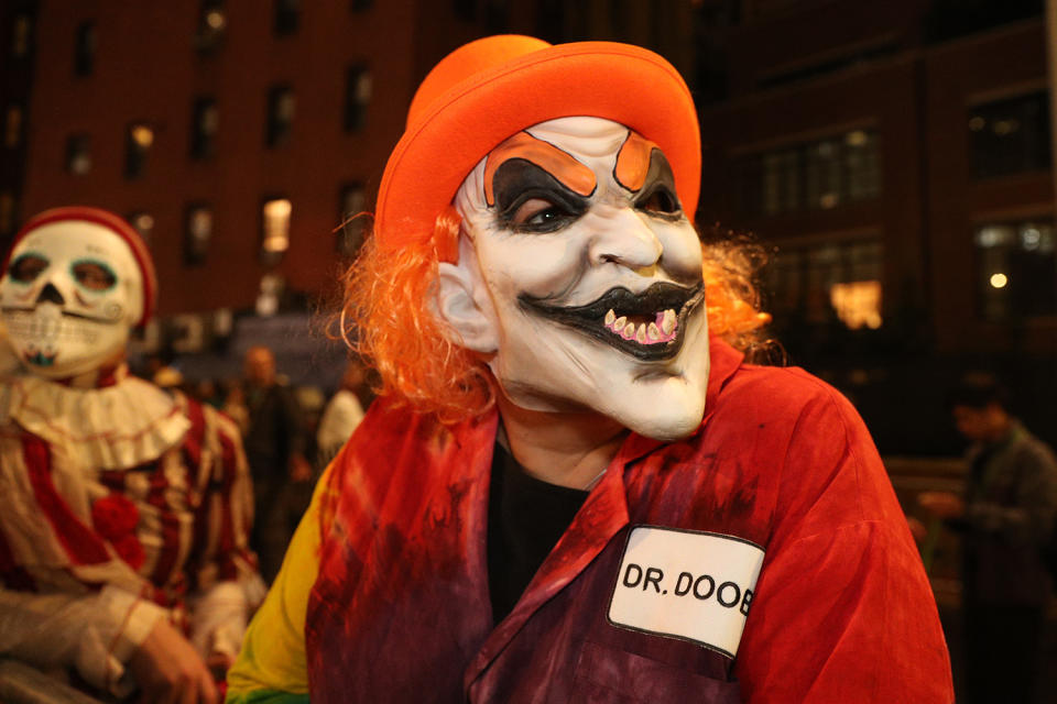 A reveler dressed as a killer clown marches in the Halloween Parade in New York. (Photo: Gordon Donovan/Yahoo News)