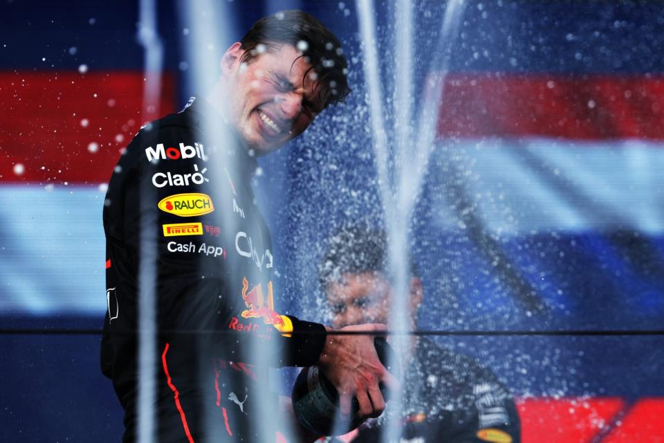 MIAMI, FLORIDA - MAY 08: Race winner Max Verstappen of the Netherlands and Oracle Red Bull Racing celebrates on the podium during the F1 Grand Prix of Miami at the Miami International Autodrome on May 08, 2022 in Miami, Florida. (Photo by Mark Thompson/Getty Images)