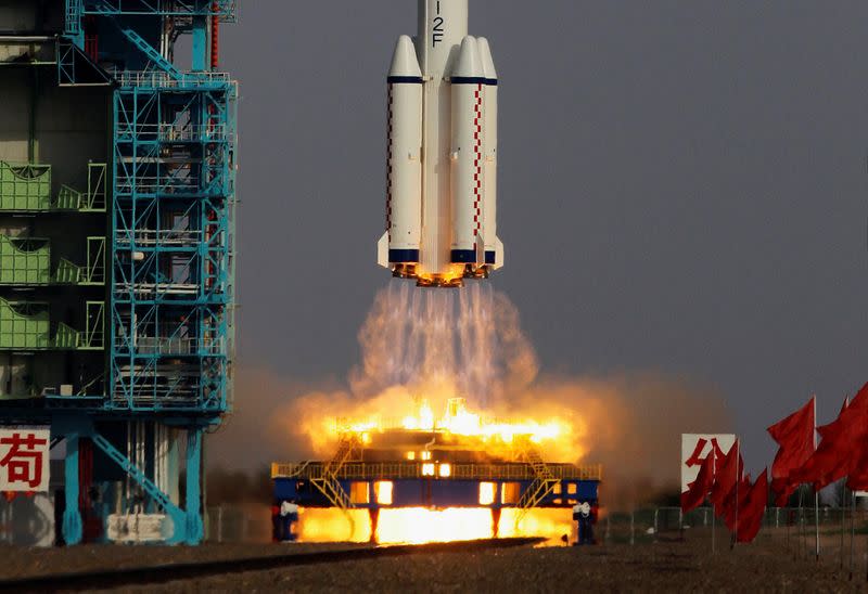FILE PHOTO: The Long March II-F rocket loaded with a Shenzhou-9 manned spacecraft lifts off from the launch pad in the Jiuquan Satellite Launch Center, Gansu province