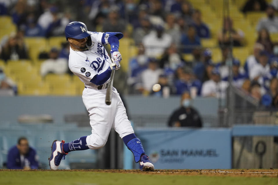 Los Angeles Dodgers' Mookie Betts doubles during the eighth inning of a baseball game against the Arizona Diamondbacks Wednesday, Sept. 15, 2021, in Los Angeles. (AP Photo/Ashley Landis)