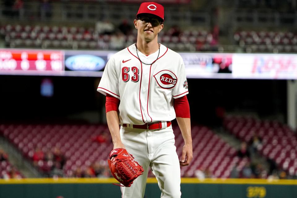 Cincinnati Reds relief pitcher Phillip Diehl (63) smiles as he walks back to the dugout during the sixth inning of a baseball game against the San Diego Padres, Wednesday, April 27, 2022, at Great American Ball Park in Cincinnati.