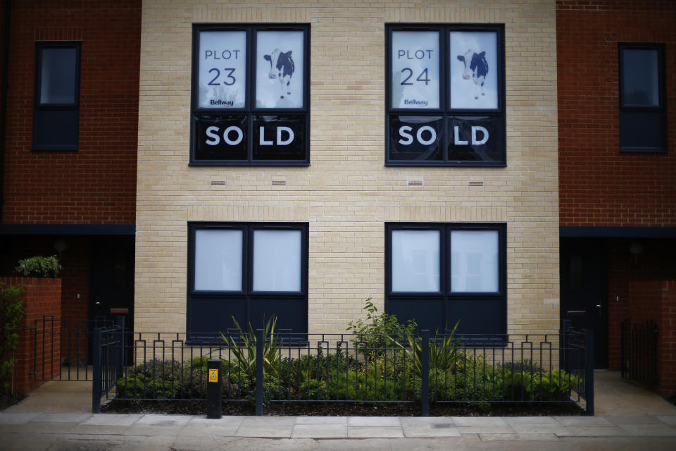 Sold new build homes are seen on a development in south London June 3, 2014. Britain's house prices rose at their fastest annual pace in nearly seven years last month and signs of bottlenecks in the construction sector underscored the upward pressures on the market, surveys showed on Tuesday. House price growth picked up to an annual pace of 11.1 percent in May, mortgage lender Nationwide said, fanning concerns that the property market could be overheating.  REUTERS/Andrew Winning   (BRITAIN - Tags: POLITICS BUSINESS REAL ESTATE)