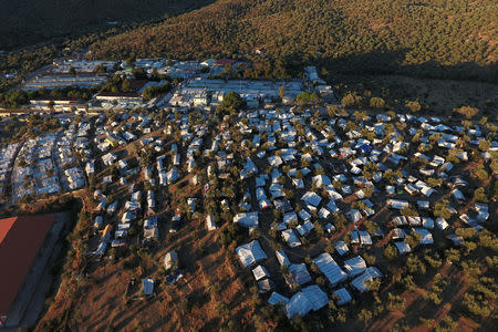 A view of the Moria camp for refugees and migrants and a makeshift camp set next to Moria, on the island of Lesbos, Greece, September 19, 2018. REUTERS/Giorgos Moutafis