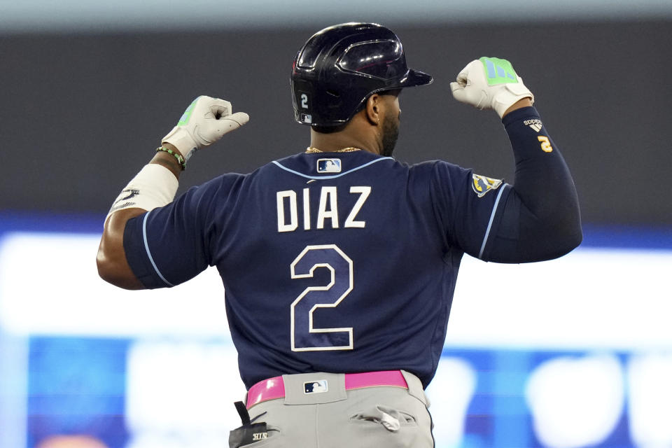 Tampa Bay Rays' Yandy Diaz flexes as he rounds the bases after hitting a two-un home run against the Toronto Blue Jays during the sixth inning of a baseball game Friday, Sept. 29, 2023, in Toronto. (Chris Young/The Canadian Press via AP)