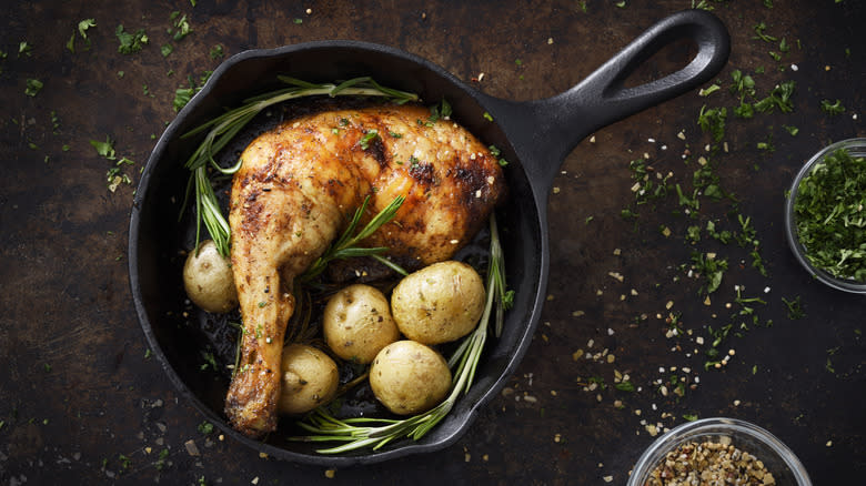 Chicken and potatoes in a skillet