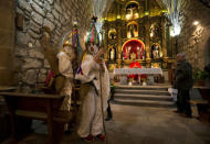 Revellers, dressed as "Zarramache", stand inside a local church at the end of a mass during celebrations to mark Saint Blaise's festivity in Casavieja, Spain February 3, 2017. REUTERS/Sergio Perez